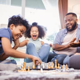Family game night playing chess